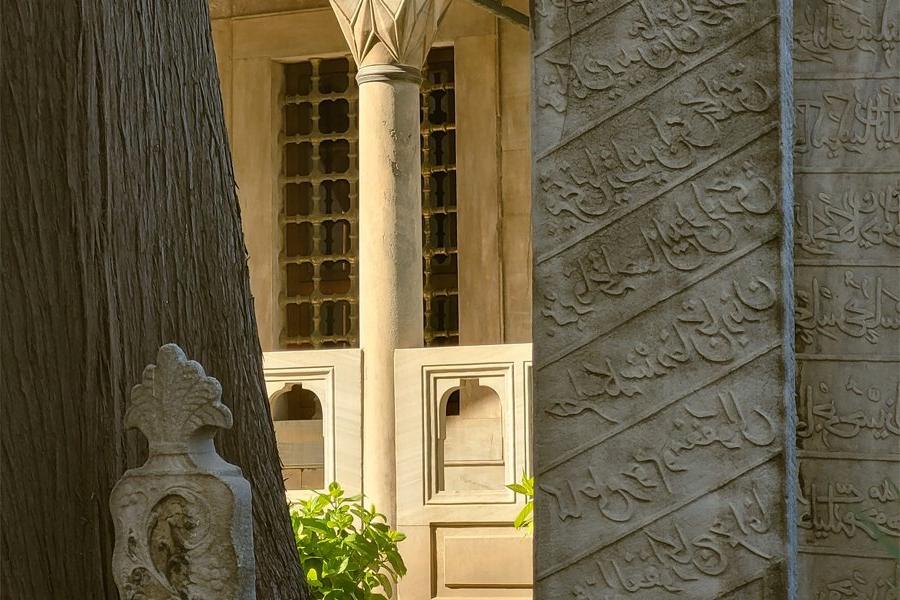 A pillar with Arabic writing.