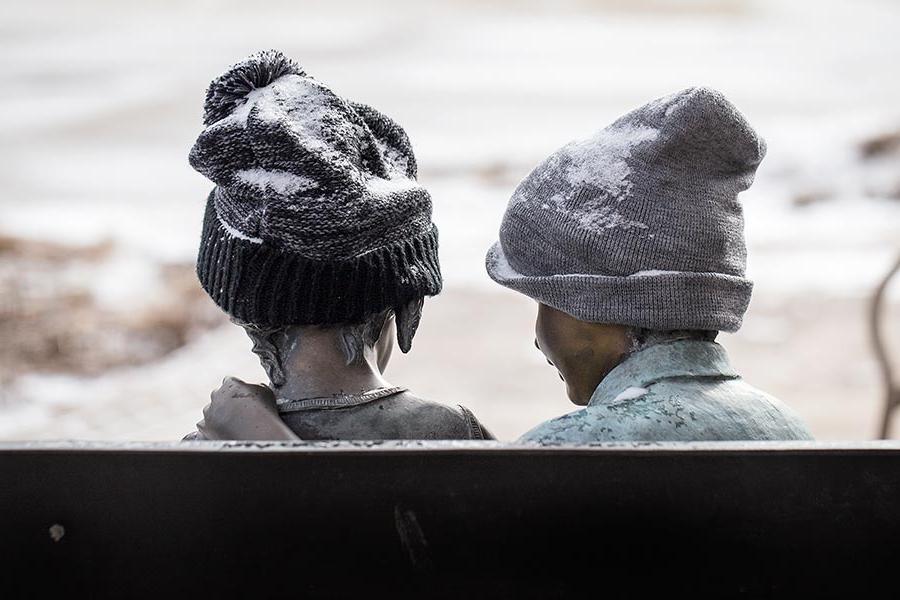 Children statue outside of the College of Education and Professional Studies