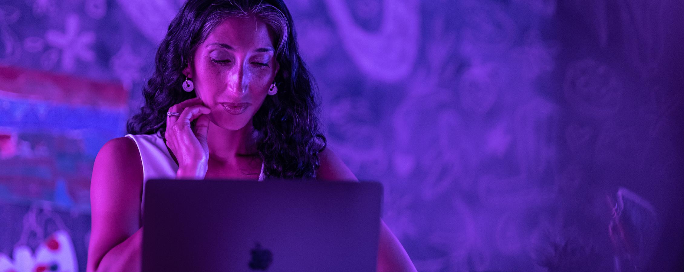 Woman sitting at monitor taking online college class